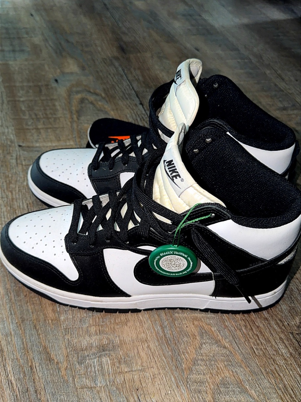 Nike Black and White High-Top Sneakers with Green Tag